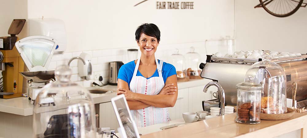 Coffeeshop owner enjoying the benefits of a business loan